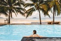 Carefree woman relaxation in swimming pool summer Holiday concept Royalty Free Stock Photo