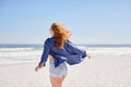 Carefree woman running along the seashore Royalty Free Stock Photo