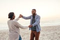 Carefree young African couple dancing together at the beach Royalty Free Stock Photo