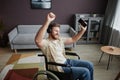 Carefree Young Man with Disability Dancing in Wheelchair Royalty Free Stock Photo