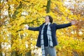 Carefree young man standing outdoors with open arms Royalty Free Stock Photo