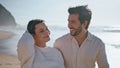 Carefree young spouses stroll on sunny coast close up. Couple walking beach Royalty Free Stock Photo