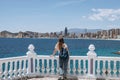 Carefree young tourist woman in sun hat enjoying sea view at Balcon Royalty Free Stock Photo