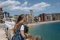 Carefree young tourist woman in sun hat enjoying sea view at Balcon Royalty Free Stock Photo