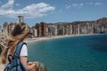 Carefree young tourist woman in sun hat enjoying sea view at Balcon Royalty Free Stock Photo