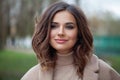 Carefree young woman brunette smiling, outdoor portrait Royalty Free Stock Photo