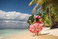 Carefree young woman relaxing on tropical beach. Isla Saona, Dominicana