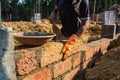 Careful Brick Placement During Wall Construction Royalty Free Stock Photo