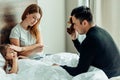 Caucasian young father and mother with ill daughter on bed Royalty Free Stock Photo