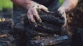 Careful hands stacking freshly strips of peat into a neat pile Royalty Free Stock Photo