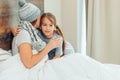 Careful kid girl and sick mother at home Royalty Free Stock Photo