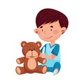 Careful Little Boy in Medical Wear Treating Teddy Bear Vector Illustration