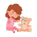 Careful Little Girl in Medical Wear Treating Teddy Bear Vector Illustration