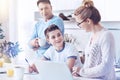 Careful mother helping son with homework at home Royalty Free Stock Photo