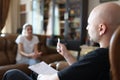 Careful psychologist listens to woman patient in office