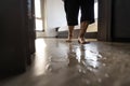 Careful of slippage,danger,accident,asian senior woman is stepping on the wet floor,water spills,old people walking on wet area, Royalty Free Stock Photo