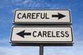 Careful versus careles road sign. White two street signs with arrow on metal pole with word. Directional road. Crossroads Road Royalty Free Stock Photo