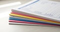 A neatly stacked collection of organized business documents, financial forms, and colorful papers. Royalty Free Stock Photo