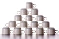 Carefully stacked pyramid of drying coffee cups