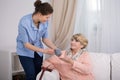 Caregiver caring about elder lady