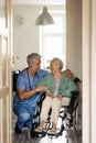 Caregiver doing regular check-up of senior woman in her home. Royalty Free Stock Photo