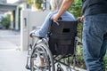 Caregiver help and care Asian senior or elderly old lady woman patient sitting on wheelchair at nursing hospital ward, healthy Royalty Free Stock Photo