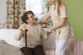 Caregiver helping senior woman Royalty Free Stock Photo