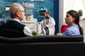 Caregiver man doctor worker explaining radiography discussing disease treatment Royalty Free Stock Photo