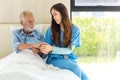 Caregiver nurse take care a Senior patient. Nurse helping senior Man Royalty Free Stock Photo