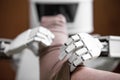 Caregiver robot or medical assisted living robot is putting on a compression stocking