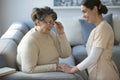 Caregiver and smiling older woman Royalty Free Stock Photo