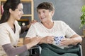 Caregiver talking to pensioner