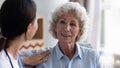 Caregiver visit consult positive senior woman patient Royalty Free Stock Photo