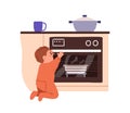 Careless child at hot stove. Kid touching oven. Unsafe dangerous situation, scorch risk at home kitchen. Baby, toddler Royalty Free Stock Photo