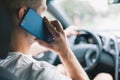 Careless driver using a mobile phone whilst driving Royalty Free Stock Photo