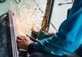 Careless worker use hand welding without safety gloves