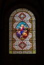 Detail view of a stained glass window in the Saint Pierre du Carennac church