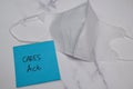Cares Act write on sticky note isolated on wooden table