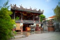 A caretaker cleaning the courtyard of Chinese temple in Penang. Royalty Free Stock Photo