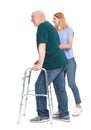 Caretaker helping elderly man with walking frame on white Royalty Free Stock Photo