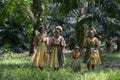 Malaysia`s indigenous Mah Meri walk in oil palm plantation