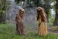 Malaysia`s indigenous tribesmen wear mask in oil palm estate