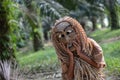 Malaysia aborigine Mah Meri with mask at oil palm estate,