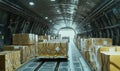 Cargo aircraft interior filled with boxes, large shipment ready for transport, organized pallets, bright exit light Royalty Free Stock Photo