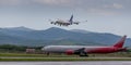 Cargo airplane Boeing 747-412 of Aerotrans Cargo company is landing. Airplane Airbus A330 of Rossiya company on the airfield