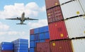 Cargo airplane flying above logistic container. Air logistic. Cargo and shipping business. Container ship for import and export Royalty Free Stock Photo