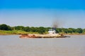 Cargo barge on the Irrawaddy river, Bagan, Myanmar, Burma. Copy space for text. Royalty Free Stock Photo