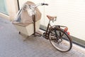 Cargo bike close up bicycle wooden basket modern fashion urban transportation parked in city