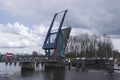 Boat approaches open lift bridge in river Oude IJssel