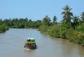 A cargo boat running on river in Mekong Delta, Vietnam Royalty Free Stock Photo